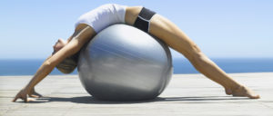 Woman working out with an exercise ball